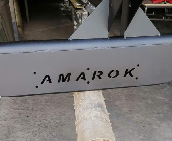 Matte finish Amarok bash plate, freshly powder coated by skilled craftsmen in their workshop, ready for installation on the vehicle of the client.